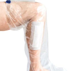A person with a waterproof sleeve dressing on the leg and foot